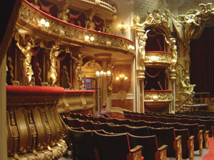 The fabulous set of the Paris Opera House for ‘Phantom of the Opera’ - 2004. This was built as a fully-operational theatre capable of holding a substantial audience in the auditorium, an orchestra and a full cast of artistes on stage. The construction used two adjoining stages at Pinewood Studios so that the action from the theatre stage could follow right through the authentic backstage area built on two floors, complete with dressing rooms, costume department, props store etc, to the stage door exit complete with stables.